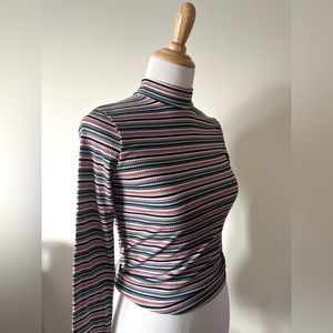 Colorful striped long sleeve tee.